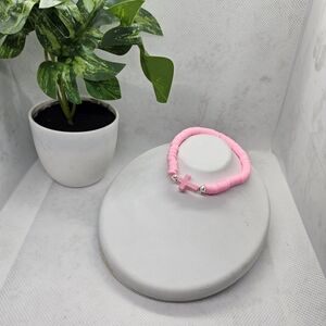 Elegant Pink Bracelet with Cross Charm